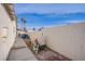 Backyard featuring a white brick fence, gravel, and pool equipment at 5399 Surrey St, Las Vegas, NV 89119