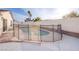 Backyard pool with a safety fence, blending security with outdoor enjoyment at 5399 Surrey St, Las Vegas, NV 89119