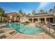 Resort-style community pool area with solar panels, lounge chairs, and umbrellas at 555 E Silverado Ranch Blvd # 2033, Las Vegas, NV 89183