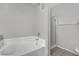 Bathroom featuring a tiled tub and separate shower enclosure at 5650 E Sahara Ave # 1029, Las Vegas, NV 89142