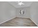 Bright bedroom with a ceiling fan and wood-look laminate floors at 5650 E Sahara Ave # 1029, Las Vegas, NV 89142