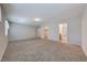 Spacious bedroom featuring soft carpeting, neutral walls, and access to an ensuite bathroom and closet at 6028 Stern Cove Ct, North Las Vegas, NV 89031