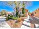 A beautiful home featuring a two-story design, a two-car garage and well-maintained landscaping at 6028 Stern Cove Ct, North Las Vegas, NV 89031