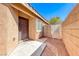 Side view of a home with a front door, window, block fence and desert landscaping at 6028 Stern Cove Ct, North Las Vegas, NV 89031