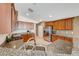 Well-lit kitchen featuring stainless steel appliances, granite countertops, and wood cabinets at 6028 Stern Cove Ct, North Las Vegas, NV 89031