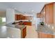 Modern kitchen featuring granite counters, stainless steel appliances and wood cabinets at 6028 Stern Cove Ct, North Las Vegas, NV 89031