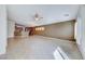 Open living space with tile floors, ceiling fan and views into the kitchen at 6028 Stern Cove Ct, North Las Vegas, NV 89031