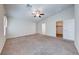 Spacious main bedroom with plush carpeting, vaulted ceiling and ensuite bathroom at 6028 Stern Cove Ct, North Las Vegas, NV 89031