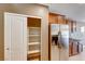 Kitchen featuring a stainless steel refrigerator with an open pantry with shelving at 6028 Stern Cove Ct, North Las Vegas, NV 89031