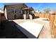 Large backyard with a concrete slab and a wooden fence at 628 Avenue L, Boulder City, NV 89005