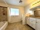 Bright bathroom featuring a shower/tub combination and white cabinetry at 628 Avenue L, Boulder City, NV 89005