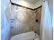 Tiled bathtub and shower with modern fixtures at 628 Avenue L, Boulder City, NV 89005