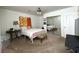 Bedroom featuring neutral carpeting and a ceiling fan with lights at 628 Avenue L, Boulder City, NV 89005