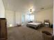 Bedroom featuring neutral carpeting and a ceiling fan with lights at 628 Avenue L, Boulder City, NV 89005