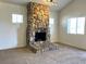 Stunning stone fireplace is the focal point of the living room at 628 Avenue L, Boulder City, NV 89005