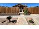 Landscaped front yard with a paved walkway leading to the cozy stone home at 628 Avenue L, Boulder City, NV 89005