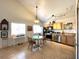 Bright kitchen with stainless steel appliances and a dining area at 628 Avenue L, Boulder City, NV 89005