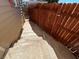 Side yard with a cement walkway and a wooden fence at 628 Avenue L, Boulder City, NV 89005