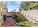 The backyard features a stone patio and lush landscaping at 6317 Beige Bluff St # 3, North Las Vegas, NV 89081