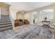 Living room with hard surface floors, neutral paint, a staircase, and ceiling fans at 6317 Beige Bluff St # 3, North Las Vegas, NV 89081