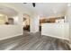 Open-concept living space showing hard surface floors, neutral paint, and a partial view of the kitchen at 6317 Beige Bluff St # 3, North Las Vegas, NV 89081