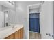 Modern bathroom with a mirror and sink at 6329 Aloha Sue St, North Las Vegas, NV 89031