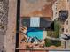 Stunning aerial view of a backyard oasis with pool, spa, and covered patio area at 6689 Sparks Ave, Las Vegas, NV 89142