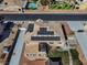 Aerial view of home showing the solar panels, backyard landscaping, pergola, and pool at 6689 Sparks Ave, Las Vegas, NV 89142