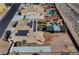 Aerial view of the home featuring solar panels, lush landscaping, a pool, and a basketball court at 6689 Sparks Ave, Las Vegas, NV 89142