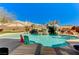 Backyard swimming pool with rock waterfall feature at 6689 Sparks Ave, Las Vegas, NV 89142