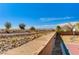 Backyard view shows walking path in desert community at 6689 Sparks Ave, Las Vegas, NV 89142