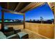 Relaxing outdoor balcony with comfortable seating and a scenic city view at twilight at 6689 Sparks Ave, Las Vegas, NV 89142