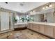 Bright bathroom with a soaking tub, double sinks, decorative curtains, and a separate shower at 6689 Sparks Ave, Las Vegas, NV 89142