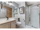 Bathroom features a glass-enclosed shower, a tile floor, and a single sink vanity at 6689 Sparks Ave, Las Vegas, NV 89142