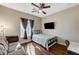 Bedroom features a ceiling fan, and a window that provides natural light at 6689 Sparks Ave, Las Vegas, NV 89142