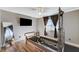 Bright bedroom with a pilates machine and a wall-mounted television at 6689 Sparks Ave, Las Vegas, NV 89142