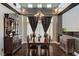 Dining room with decorative curtains, a chandelier, and dark wood floors at 6689 Sparks Ave, Las Vegas, NV 89142