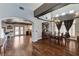 Elegant dining room with dark wood floors and views to the kitchen at 6689 Sparks Ave, Las Vegas, NV 89142