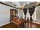 Dining room with decorative chandelier, and dark wood flooring at 6689 Sparks Ave, Las Vegas, NV 89142