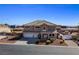 Exterior view of a two-story home with a three-car garage at 6689 Sparks Ave, Las Vegas, NV 89142