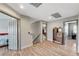 Upstairs hallway with hardwood floors, neutral walls, and plenty of natural light at 6689 Sparks Ave, Las Vegas, NV 89142