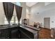 Bright living room with high ceilings, a bar, and elegant decor at 6689 Sparks Ave, Las Vegas, NV 89142