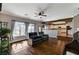 Cozy living room with a large window and views to the kitchen at 6689 Sparks Ave, Las Vegas, NV 89142