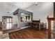 Elegant living room featuring hardwood floors, high ceilings, a full bar, and decorative lighting at 6689 Sparks Ave, Las Vegas, NV 89142