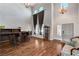 Bright living room with hardwood floors, tall ceilings, a full bar, and stylish chandeliers at 6689 Sparks Ave, Las Vegas, NV 89142