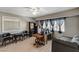Bright home office with natural light, stylish lighting, and wood flooring throughout the space at 6689 Sparks Ave, Las Vegas, NV 89142