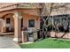 Outdoor kitchen with grill and synthetic grass at 6689 Sparks Ave, Las Vegas, NV 89142