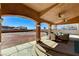 Covered patio with seating area and a view of the backyard and clear sky at 6689 Sparks Ave, Las Vegas, NV 89142