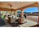 View of pool and outdoor kitchen from covered patio at 6689 Sparks Ave, Las Vegas, NV 89142