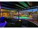 Inviting outdoor area featuring a sparkling pool, spa, and covered patio, perfect for evening relaxation at 6689 Sparks Ave, Las Vegas, NV 89142